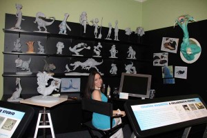 Blue Sky Studios animator Alena Wooten hangs out in a simulation of her workspace, as seen in the exhibition "'Ice Age' to the Digital Age." Photo ©Norman Rockwell Museum. All rights reserved.