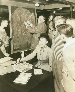 Margret and H. A. Rey at a book signing, United States, c. 1945. H. A. & Margret Rey Papers, de Grummond Children’s Literature Collection, McCain Library and Archives, The University of Southern Mississippi.